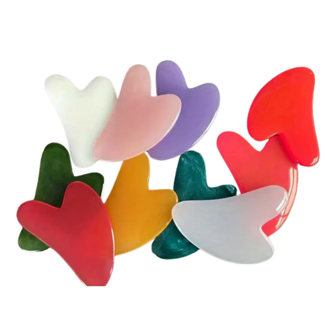 Masajeadores faciales Gua Sha en varios colores de piedra