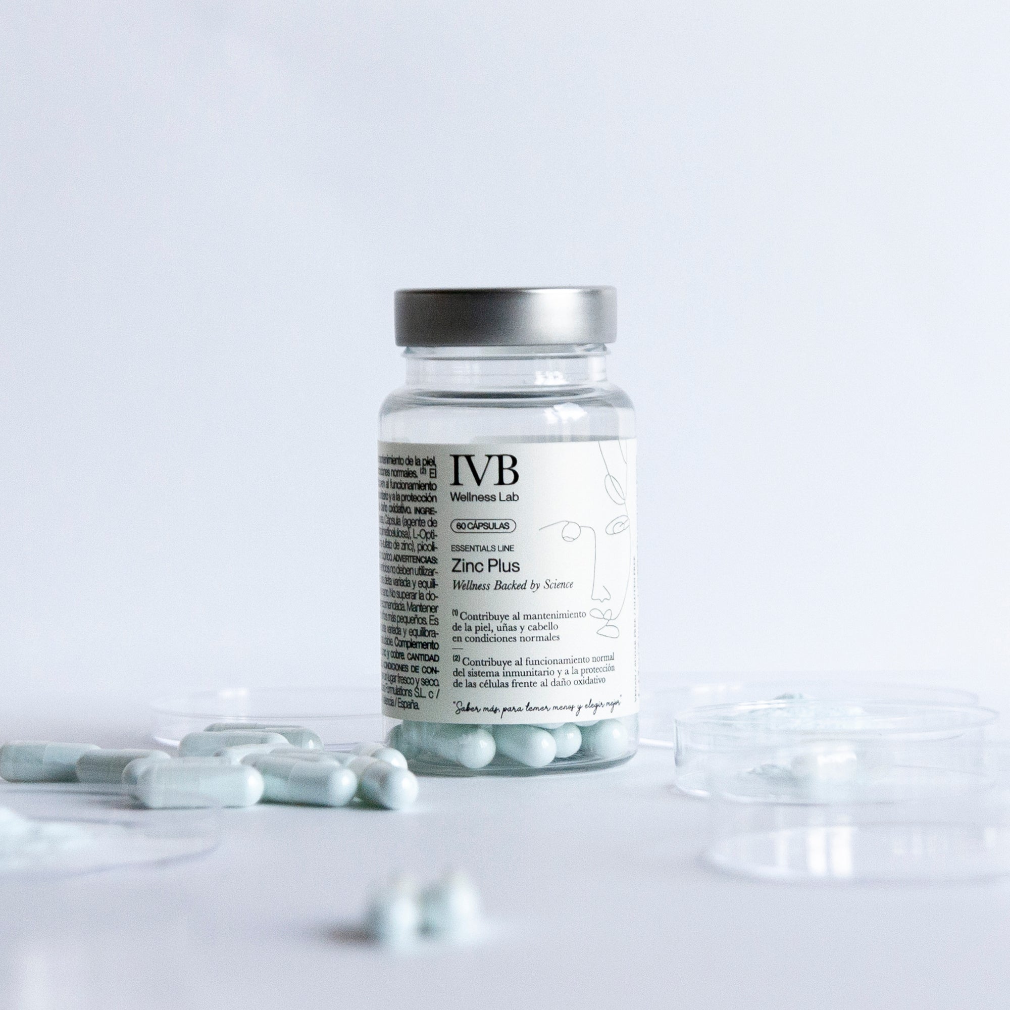 Bote de IVB Zinc Plus con 60 cápsulas y cápsulas de zinc alrededor